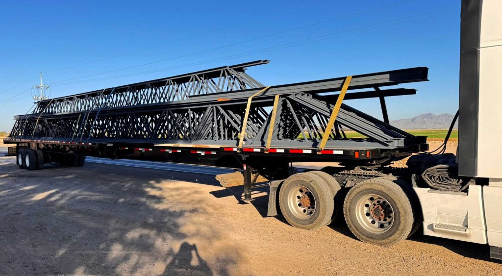stretch flatbed hauling long-span trusses