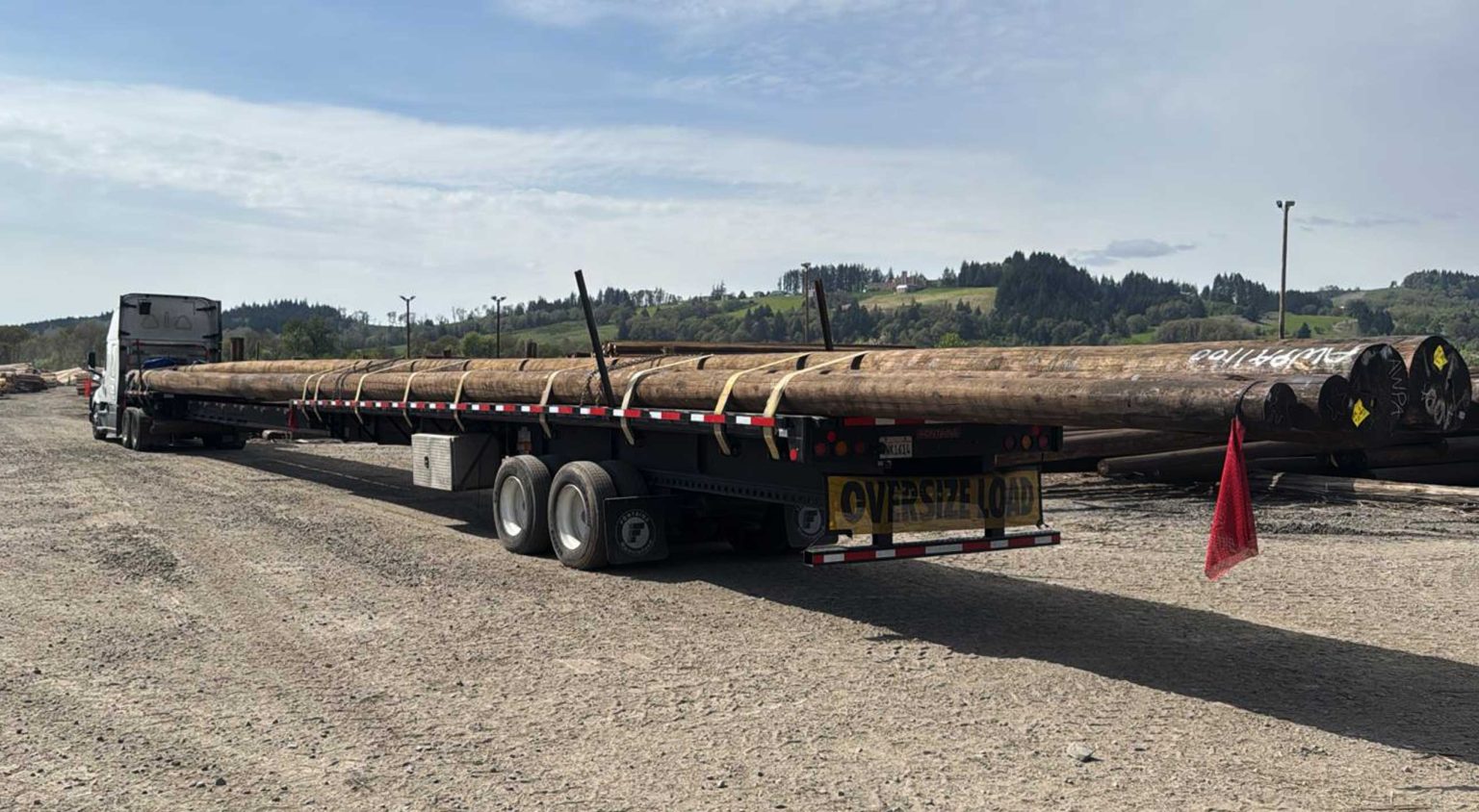 Long industrial components. Six 100-foot utility poles from Sheridan, Oregon