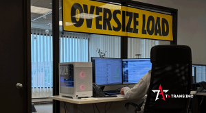 TA Trans dispatch office in Des Plaines with an oversize load banner over the desks