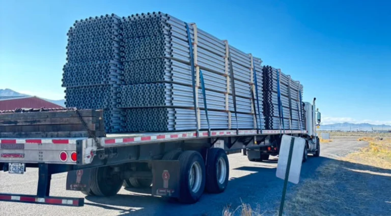 Stacked bundles of metal pipe. Milford, Utah to Fort Stockton, Texas